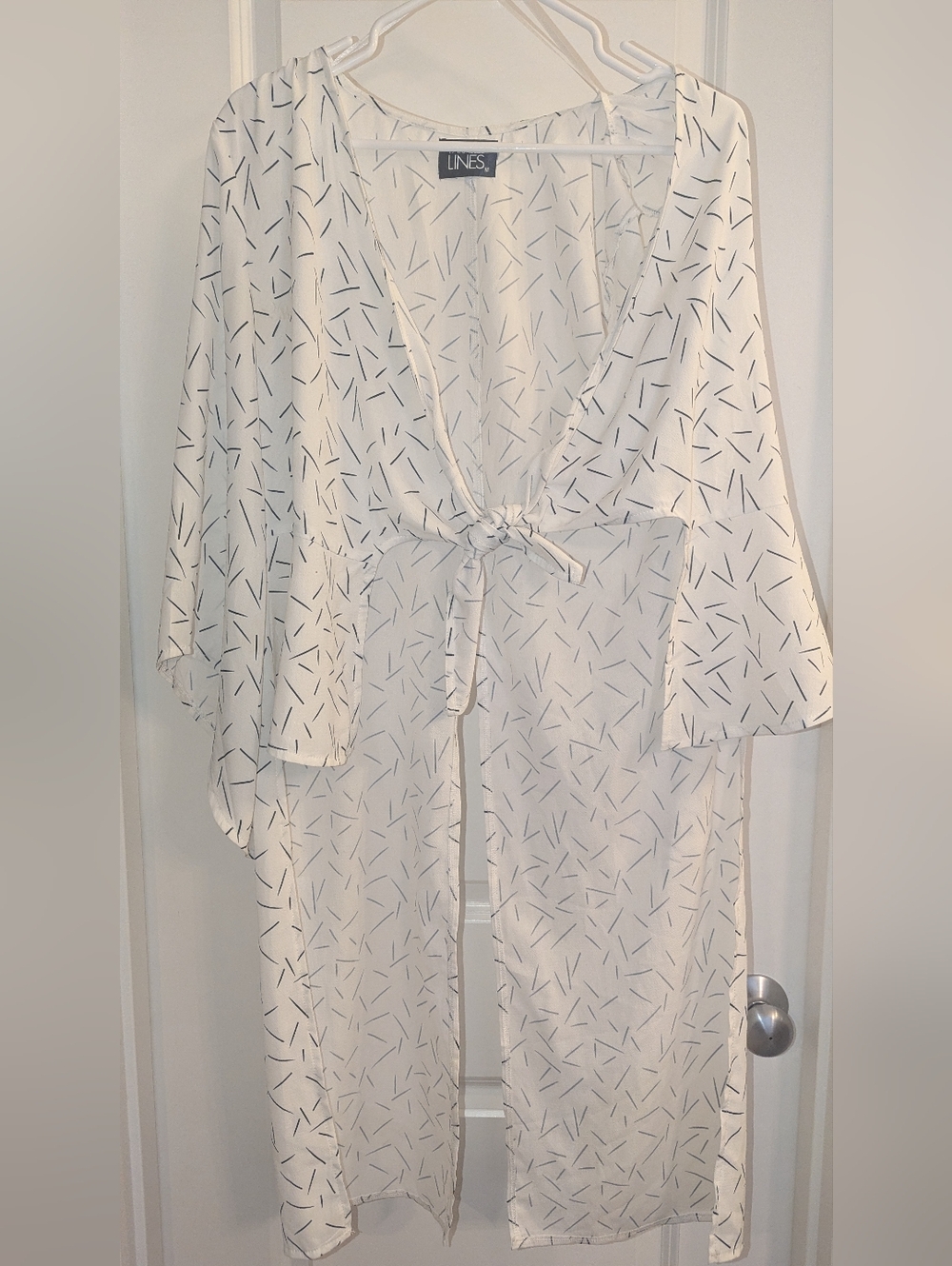 PARALLEL LINES Longline Blouse with Twist Front Detail in Abstract Print